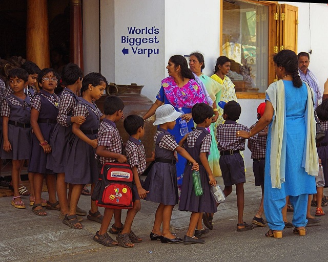 School_children_line_Cochin_Kerala_India